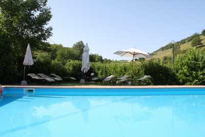 Camerino farmhouse vacation rentals: holiday farmhouse with pool for rent in Camerino Marches, farmhouse accomodations: 8 apartments